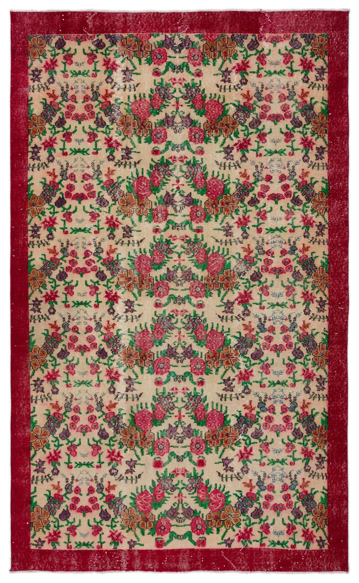 Beige rug with a red border and a repeating floral pattern in red, green, and purple on a white background.