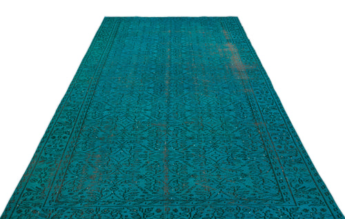 Load image 1 in gallery view. Teal vintage-style rug with a dark, intricate floral medallion pattern and distressed brown accents on a white background.