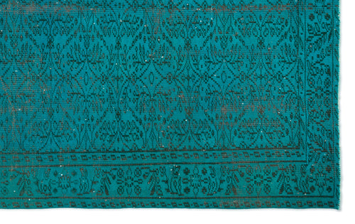 Load image 1 in gallery view. Teal rug with a dark charcoal distressed floral medallion pattern and a geometric border.