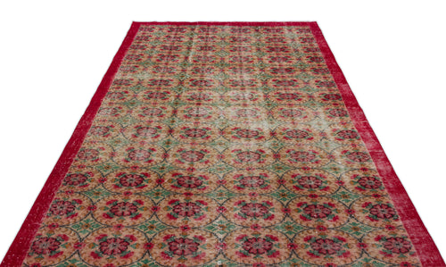 Load image 1 in gallery view. Red, beige, and green vintage-style rug with a repeating circular floral medallion pattern and a solid red border.