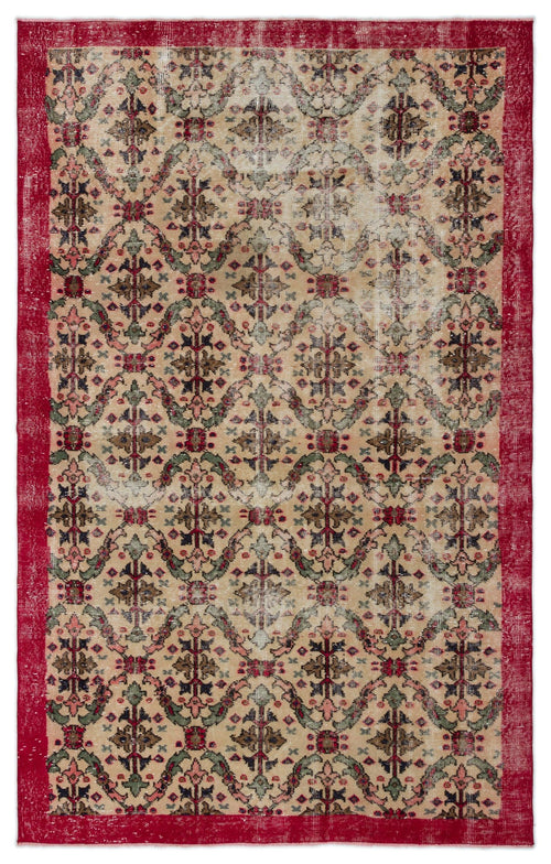 Load image 1 in gallery view. Distressed beige rug with a red border and a repeating floral medallion pattern in red, green, and dark blue.