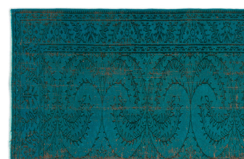 Load image 1 in gallery view. Teal rug with a dark, distressed traditional floral pattern and a geometric border on a white background.