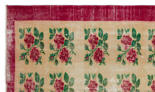 Load image 1 in gallery view. Beige rug with a repeating floral pattern in red and green, featuring a wide distressed red border.