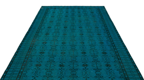 Load image 1 in gallery view. Teal rug with a dark geometric lattice and floral motif on a white background.
