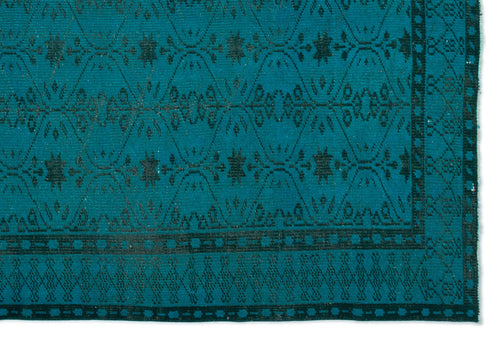 Load image 1 in gallery view. Teal rug with a black geometric diamond and floral motif, featuring a detailed border pattern.