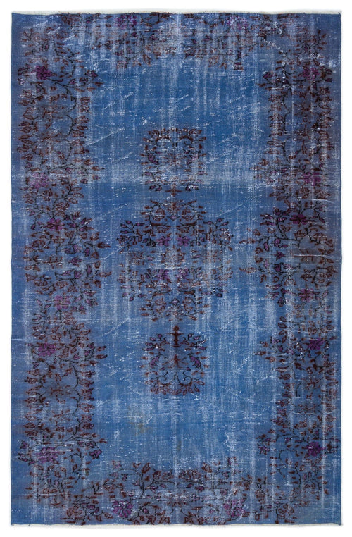 Load image 1 in gallery view. Distressed blue rug with a faded purple floral medallion and border pattern on a white background.
