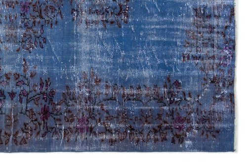 Load image 1 in gallery view. Distressed blue rug with a faded purple and dark brown floral border pattern.