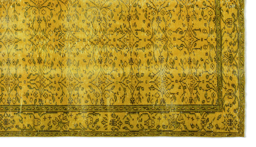 Load image 1 in gallery view. Mustard yellow and olive green rug with a distressed traditional floral medallion pattern and a decorative border.