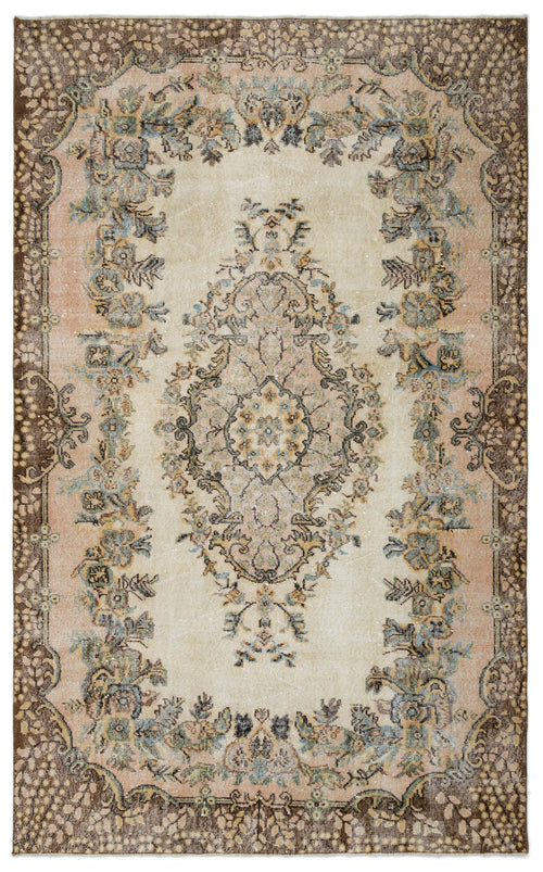 Load image 1 in gallery view. Distressed beige, brown, and muted blue traditional rug with a central floral medallion and ornate border.