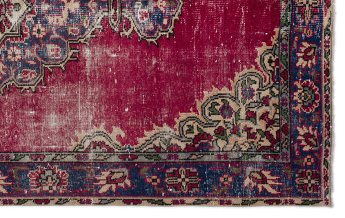 Load image 1 in gallery view. Distressed magenta rug with a traditional floral medallion pattern, navy blue border, and beige accents.