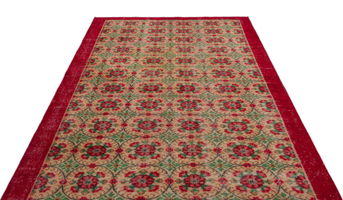 Load image 1 in gallery view. Red, green, and beige vintage-style rug with a repeating circular floral medallion pattern and a solid red border.