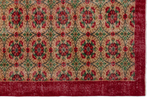 Load image 1 in gallery view. Tan rug with a repeating circular lattice pattern featuring red floral motifs, green accents, and a solid red border.
