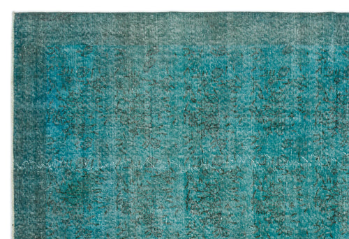 Load image 1 in gallery view. Teal and black distressed vintage-style rug with a faded, overdyed texture and subtle worn pattern.