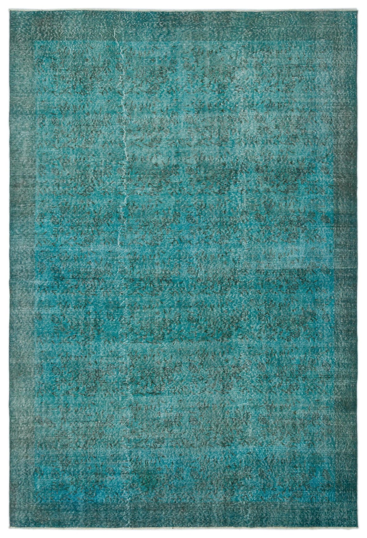 Teal and dark green distressed overdyed rug with a faded, textured vintage pattern.