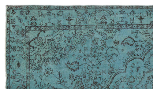 Load image 1 in gallery view. Teal rug with a dark brown distressed floral and vine pattern and a traditional border.