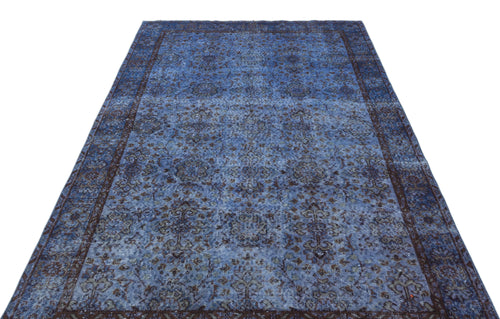Load image 1 in gallery view. Blue and dark brown distressed traditional rug with an intricate floral medallion pattern on a white background.