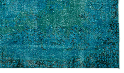 Load image 1 in gallery view. Teal and navy blue distressed rug with a faded traditional floral medallion pattern.