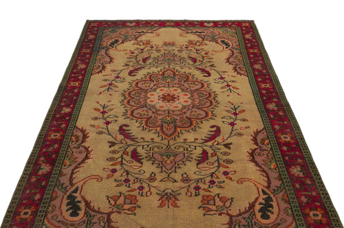 Load image 1 in gallery view. Beige traditional rug with a central floral medallion, intricate botanical motifs, and a red and green border.