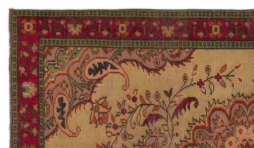 Load image 1 in gallery view. Tan traditional rug with a red and green floral border and intricate paisley and botanical motifs.
