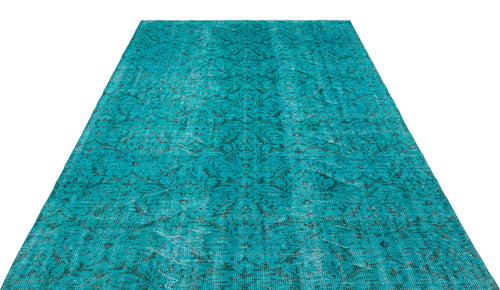 Load image 1 in gallery view. Teal distressed rug with a faded traditional floral medallion pattern on a white background.