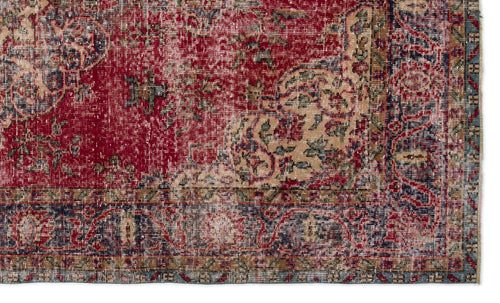 Load image 1 in gallery view. Distressed red, beige, and navy blue traditional rug with an intricate floral medallion pattern and a wide border.
