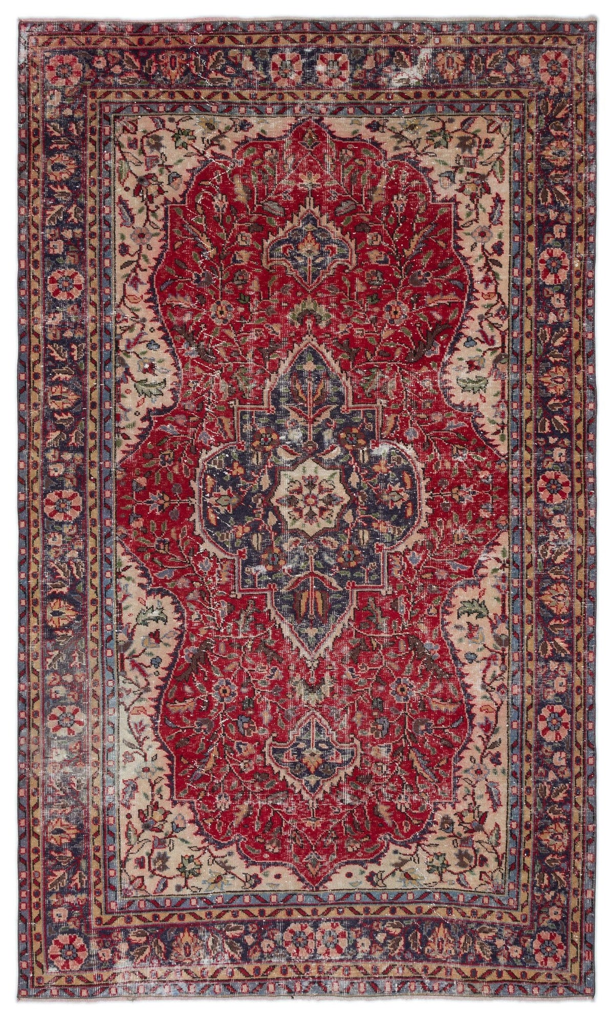 Distressed red, navy, and cream Persian-style rug with a central floral medallion and intricate border patterns.
