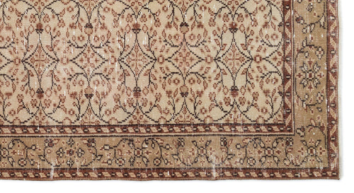 Load image 1 in gallery view. Beige and brown vintage-style rug with a distressed floral trellis pattern and a decorative border.