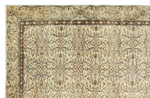 Load image 1 in gallery view. Beige and sage green vintage-style rug with a dark brown floral vine border and intricate central botanical pattern.