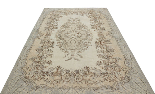 Load image 1 in gallery view. Beige and grey vintage-style rug with a central floral medallion and ornate botanical border on a white background.
