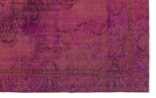 Load image 1 in gallery view. Magenta and deep purple distressed rug with a traditional ornate border and faded floral pattern.