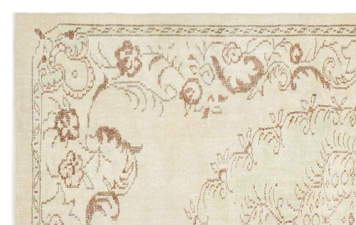 Load image 1 in gallery view. Cream rug with a distressed brown floral border and vine pattern on a white background.