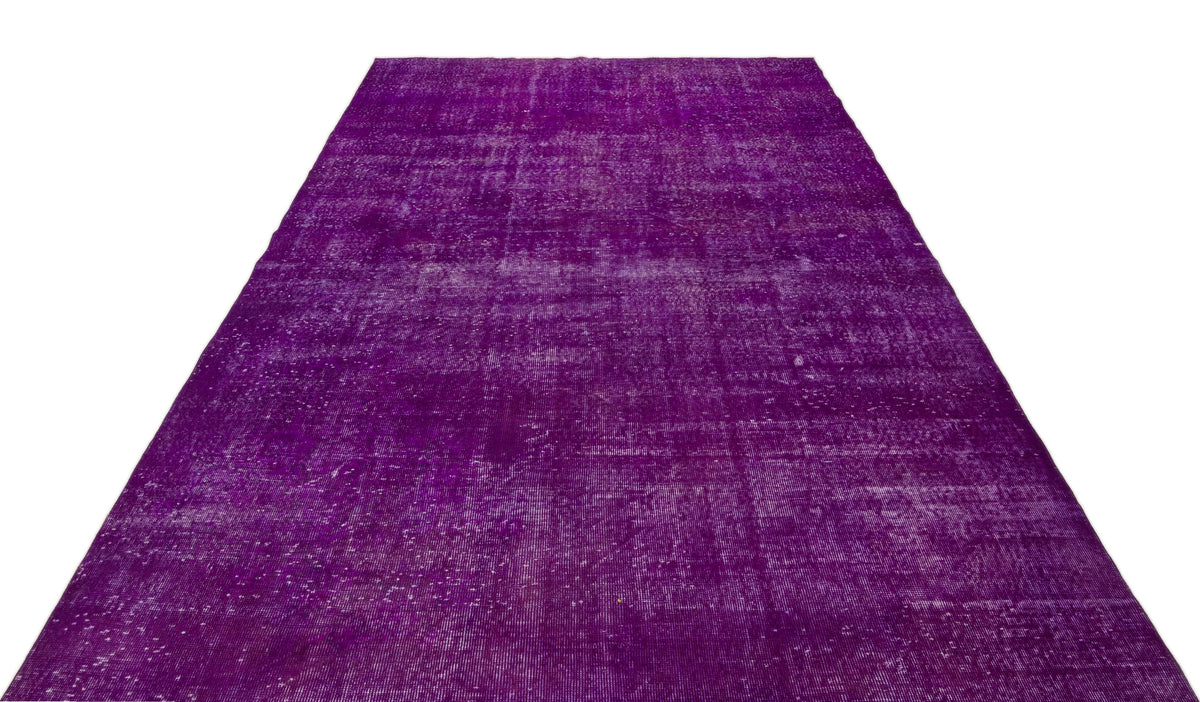 Deep purple vintage-style rug with a distressed, faded texture on a white background.
