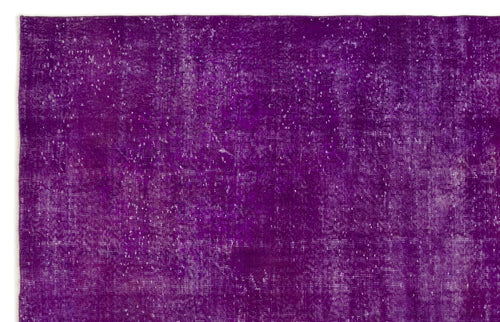 Load image 1 in gallery view. Deep purple vintage-style rug with a distressed, faded texture and white worn-in details.
