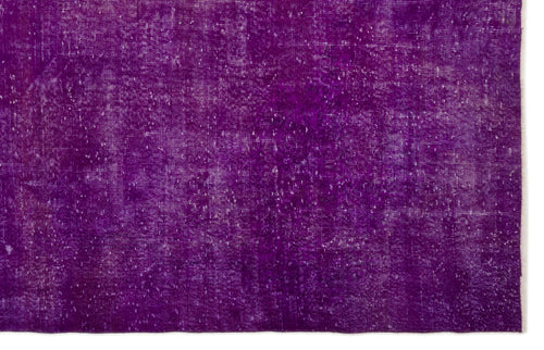 Load image 1 in gallery view. Solid deep purple rug with a distressed, weathered texture and visible white woven base.
