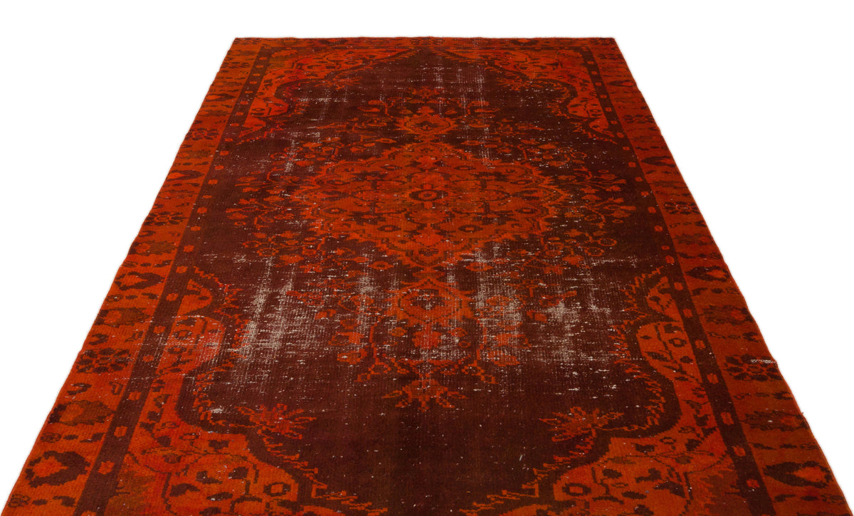 Deep red and dark brown traditional rug with a distressed central medallion and ornate border on a white background.