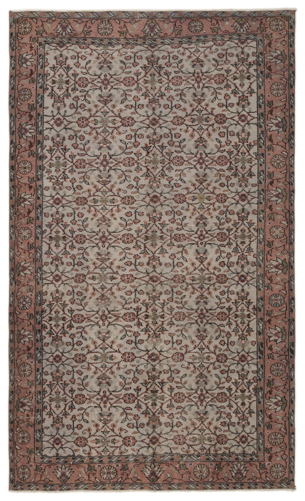 Muted pink and grey traditional rug with an all-over floral vine pattern and a wide decorative border.