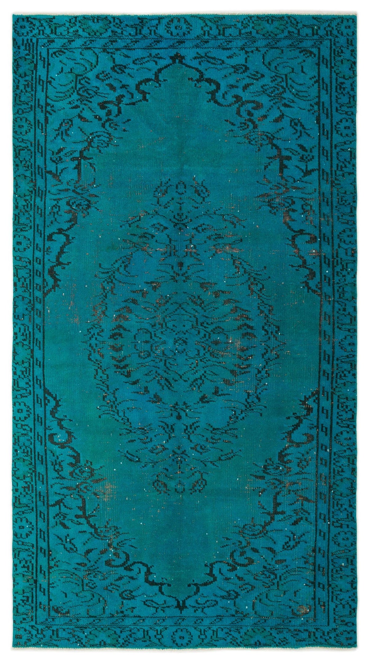 Teal vintage-style rug with a distressed black floral medallion pattern and a decorative border.