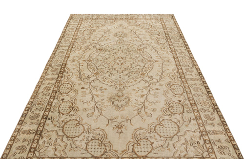 Load image 1 in gallery view. Beige and brown vintage-style rug with a central floral medallion and intricate botanical border on a white background.
