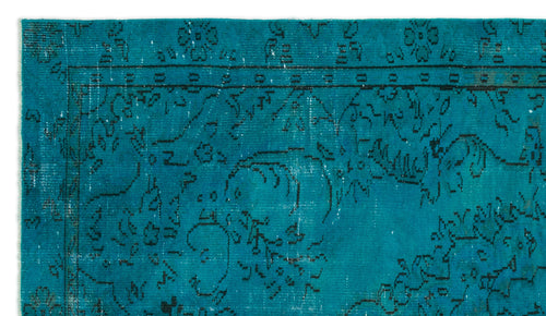 Load image 1 in gallery view. Teal rug with a distressed black floral medallion pattern and a decorative border.