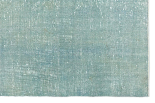 Load image 1 in gallery view. Solid light blue rug with a distressed, weathered texture and visible white woven detailing.
