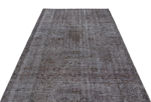 Load image 1 in gallery view. Charcoal and grey distressed vintage-style rug with a faded traditional medallion pattern on a white background.