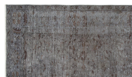 Load image 1 in gallery view. Grey and brown distressed traditional rug with a faded floral medallion pattern and a geometric border.