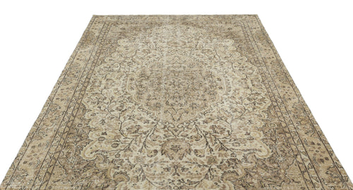 Load image 1 in gallery view. Beige and brown traditional rug with a distressed floral medallion pattern and ornate border on a white background.