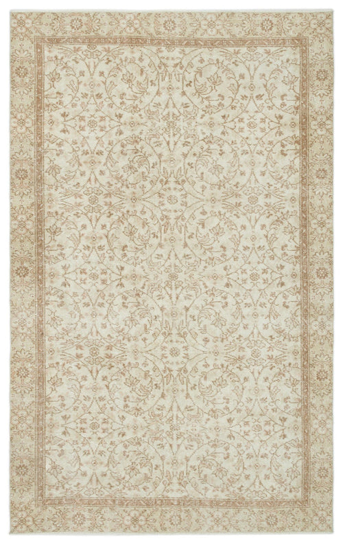 Load image 1 in gallery view. Beige and cream traditional rug with a distressed floral medallion pattern and a decorative border.