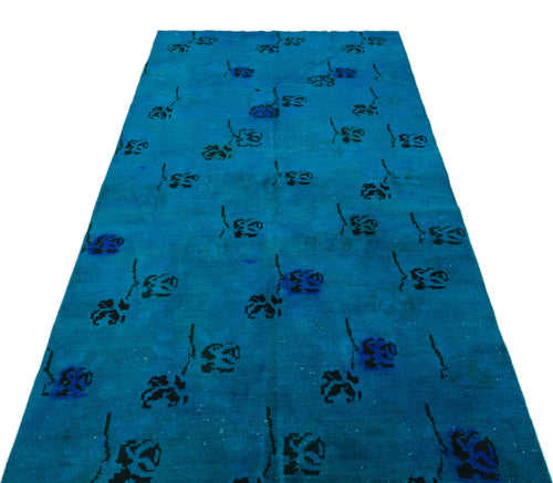 Load image 1 in gallery view. Bright blue runner rug with a scattered black and dark blue floral stem pattern.