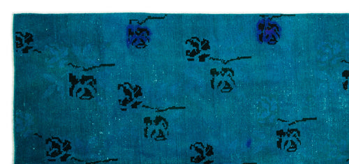 Load image 1 in gallery view. Teal rug with a distressed texture and scattered black abstract floral motifs.