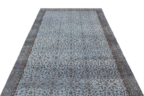 Load image 1 in gallery view. Light blue and dark brown vintage-style rug with an intricate floral medallion pattern and a wide decorative border.