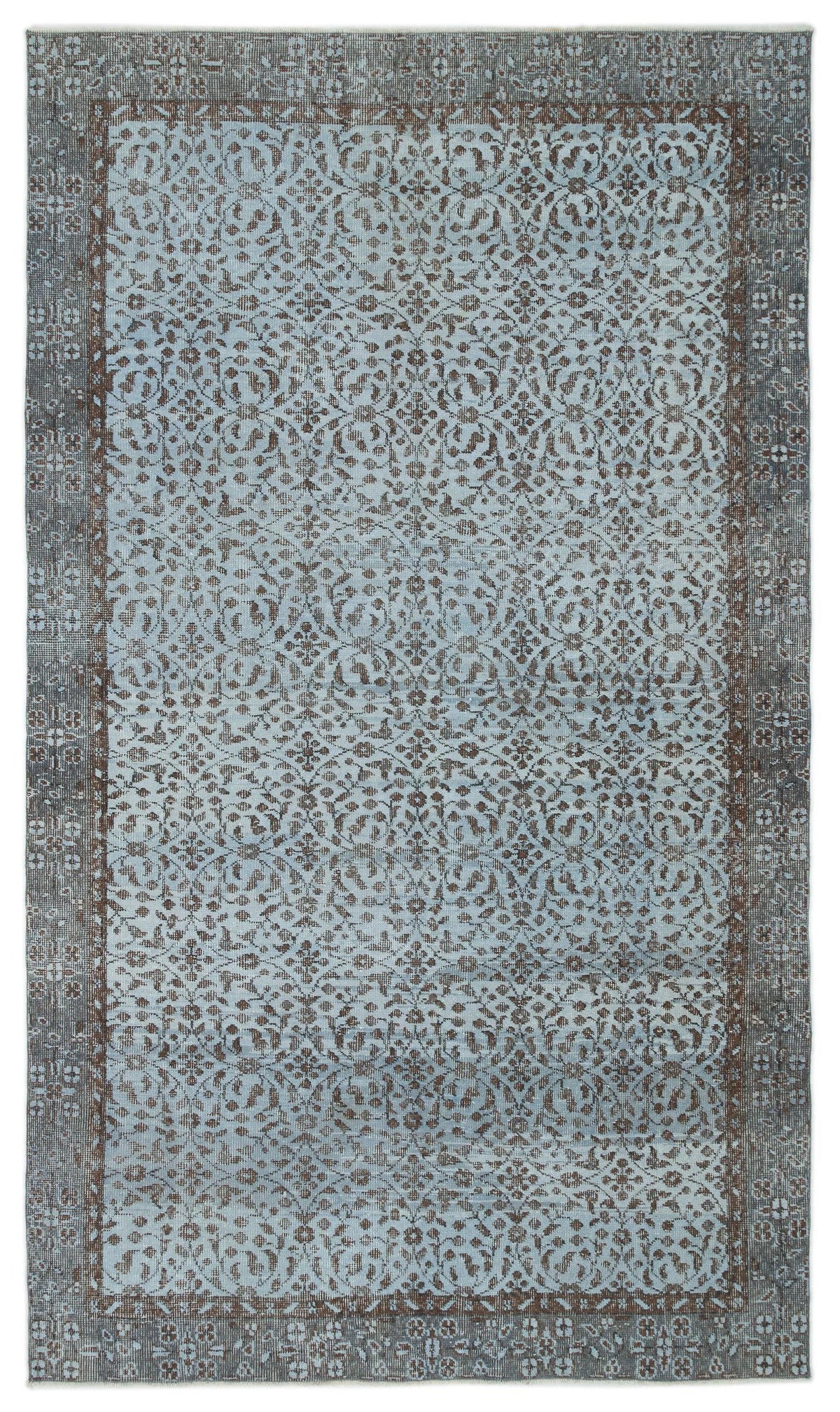 Light blue and charcoal grey rug with a distressed traditional floral pattern and a wide decorative border.