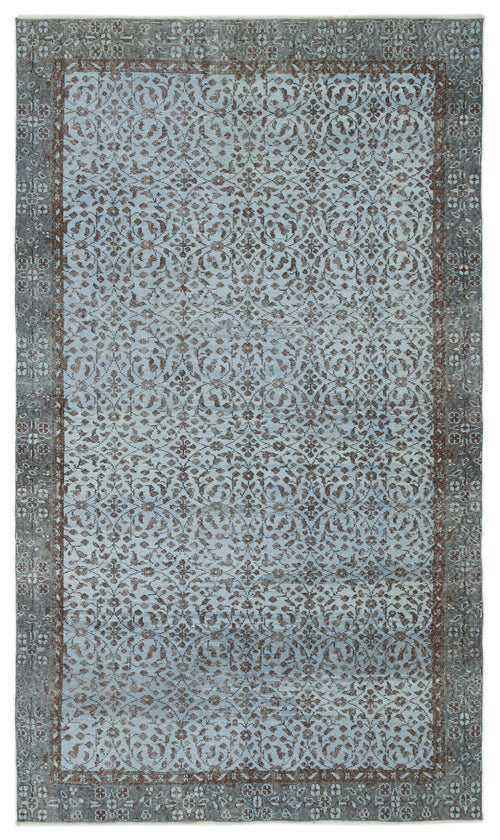 Load image 1 in gallery view. Light blue and charcoal grey rug with a distressed traditional floral pattern and a wide decorative border.