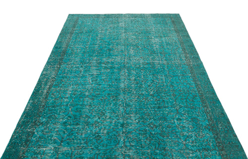 Load image 1 in gallery view. Teal distressed vintage-style rug with a dark floral medallion pattern on a white background.